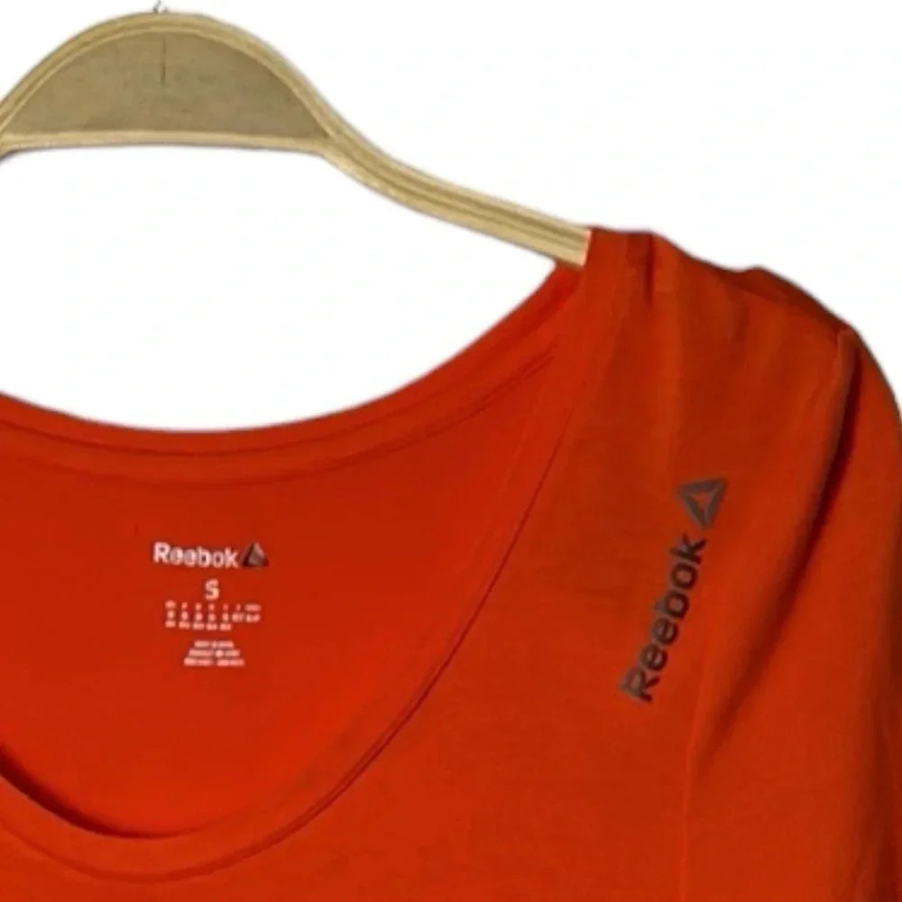 REEBOK. Orange activewear tee shirt  . Logos ,scoop neckline , longer cap sleeve - Picture 3 of 7